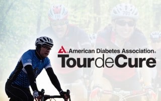 A cyclist in a blue jersey rides a bike in the foreground with the text "American Diabetes Association Tour de Cure" overlaid, powered by Activated Insights. In the background, blurred images of other cyclists in red jerseys are visible, all wearing helmets and sunglasses.