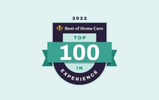 2022 Best of Home Care Top 100 in Experience badge with a green banner and white text against a light green background.
