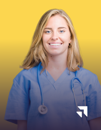 A smiling woman with blonde hair wearing blue medical scrubs and a stethoscope around her neck stands against a yellow gradient background. A small white logo is in the bottom right corner.
