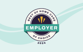 A circular badge with a dark center reads "BEST OF HOME CARE" at the top, "OF CHOICE" at the bottom, and "EMPLOYER" across the middle in a green ribbon. Inside the dark center is a yellow icon. The year "2024" is written at the bottom. The background has light teal waves.