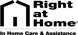 Logo for "Right at Home In Home Care & Assistance" featuring a stylized house graphic to the left of the company name in bold black text on a white background.